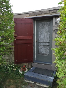 The screen door to my cottage at NISDA.